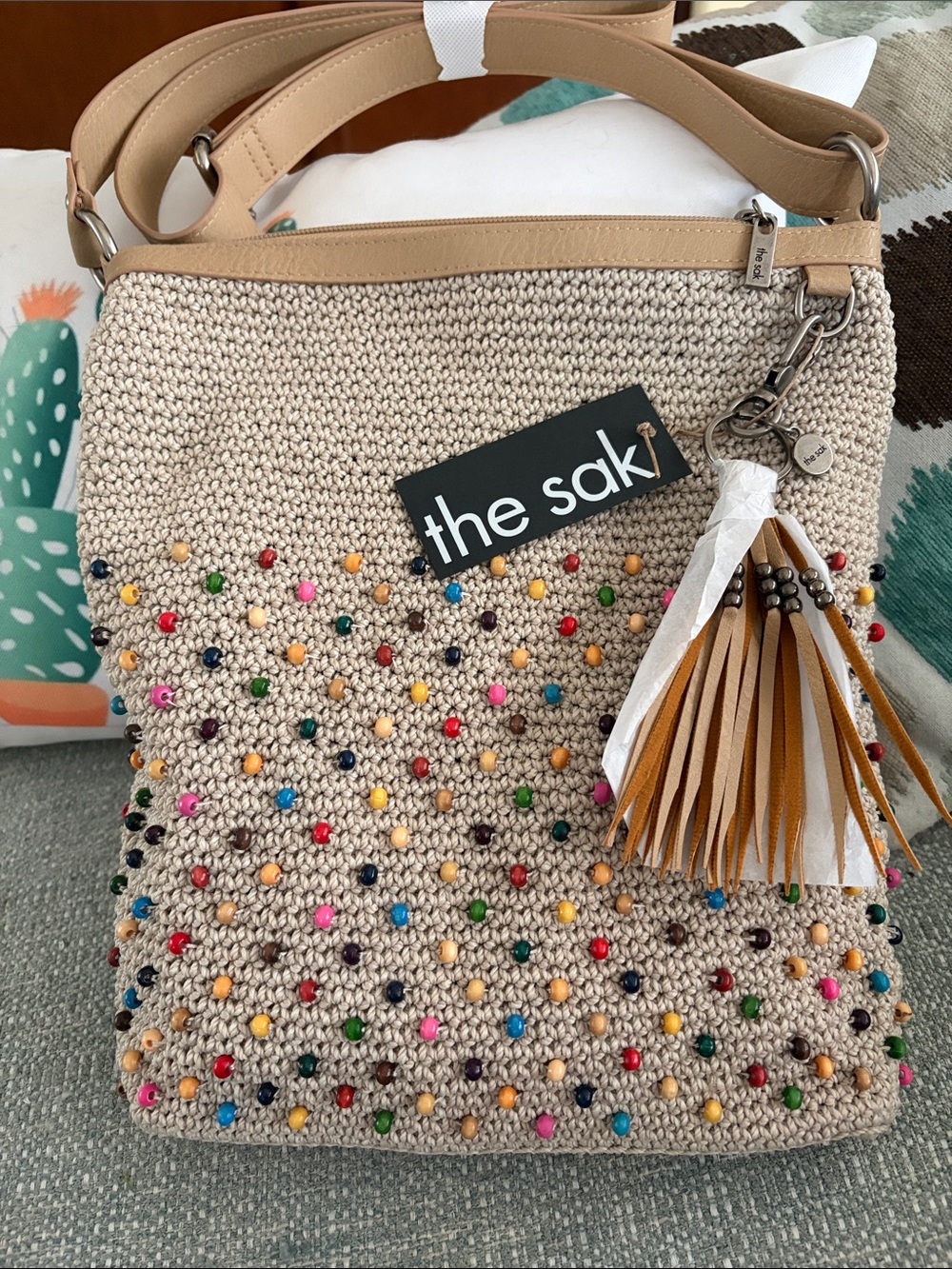 The Sak Beige Crochet Shoulder Bag with Multicolor Beads and Tan Tassel